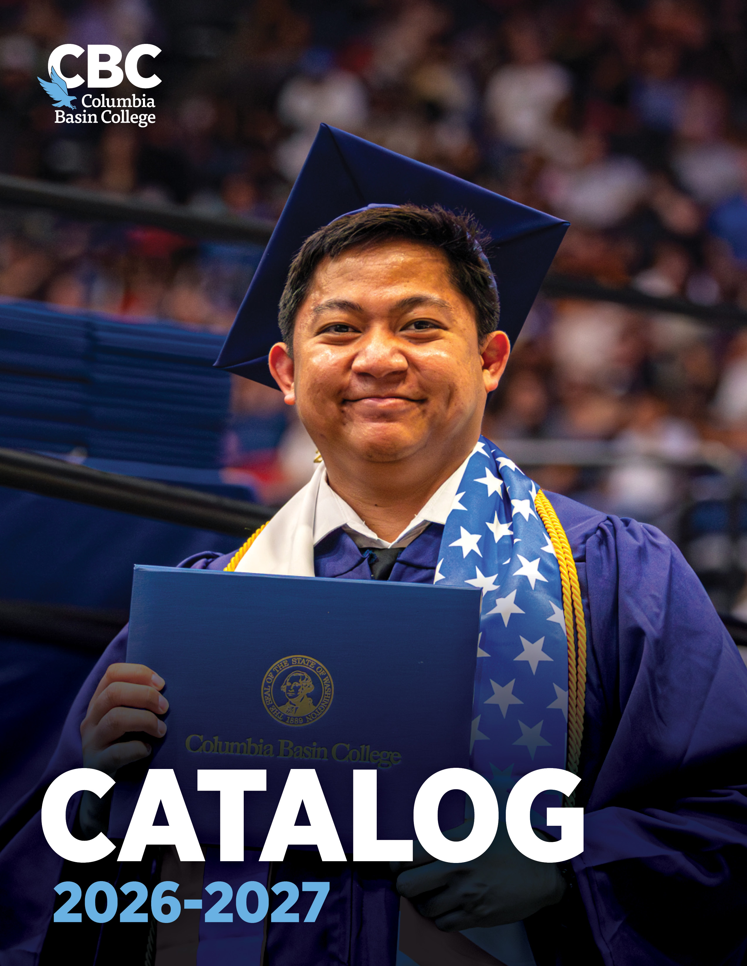 graduate holding diploma cover